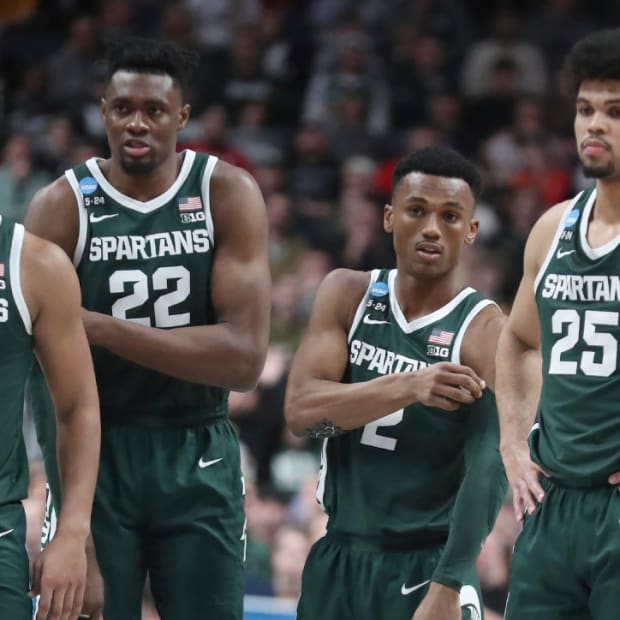 Michigan State men’s basketball players A.J. Hoggard, Mady Sissoko, Tyson Walker and Malik Hal wait for play to begin during the 2023 NCAA men’s tournament Round of 32 game.